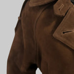 Close up of the suede texture, lapel and button on the JJerrold chocolate brown suede trench coat