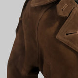 Close up of the suede texture, lapel and button on the JJerrold chocolate brown suede trench coat